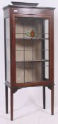 An Edwardian mahogany stencil inlaid stained glass display cabinet.
