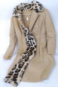 A stunning full length sheepskin coat having a simulated faux fur leopard / Ocelot collar please