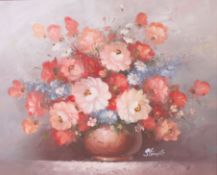 A 20th century oil on canvas of a still life study of a flower arrangement