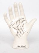A `Palmistry` ceramic hand for instruction purposes.