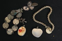A  collection of vintage jewellery to include silver coin bracelets x2, gentlemans cuffs,