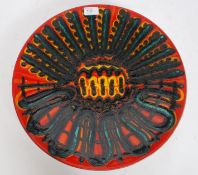 A large Poole Pottery Delphis / Aegean charger shape 54 being decorated in an abstract pattern in