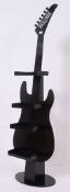 An unusual large metal form display - point of sale industrial stand in the form of a guitar