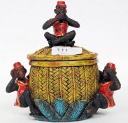 An unusual 20th century resin case painted tobacco jar adorned with monkeys surrounding bamboo