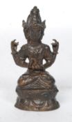 A 20th century Chinese bronze  figural study of a Tibetan three headed deity  in prayer position