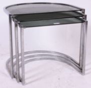 A 1970's half moon shaped chrome and smoked glass retro nest of tables together with 3 vintage
