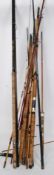 A collection of 20th century fishing rods to include sea fishings.