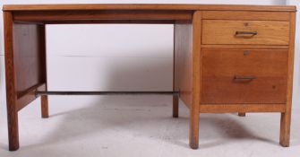 A good 1950's solid oak Air Ministry style desk having pedestal bank of drawers with open kneehole