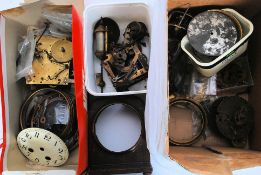 A collection of watch and clock spares, to include faces, cogs,