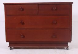 A good quality 20th century oak chest of drawers raised on castors with inset plinth base.