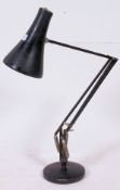 A vintage industrial workmans Anglepoise branded anglepoise desk lamp, in black.