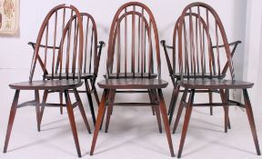 A set of 6  Ercol 1970's Quaker beech and elm wood dining chairs being raised on turned legs united