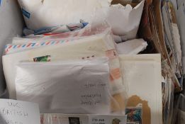 STAMPS: A large box of assorted loose used QEII kiloware / stamps