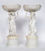 A pair of 19th century  German porcelain centrepieces ( centrepiece )  with a ribbon basket top  to