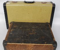 A vintage mid century suitcase along with a vintage Salisbury Laundry advertising box full with