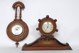 A 1920's Oak mantel barrel - wheel clock having inset swill movement.