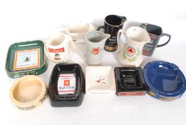 A collection of breweriana collectors advertising jugs and ashtrays to include makers such as Wade,