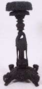 A late 19th century Anglo Colonial Burmese carved hardwood jardiniere stand.