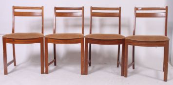 A 1970's set of 4 retro teak wood upholstered bar back dining chairs with padded seats and on