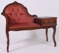 A 20th century Rococo revival hall seat - telephone table having pink velour upholstery.