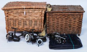 A collection of fishing reels to include examples : Daiwa's,