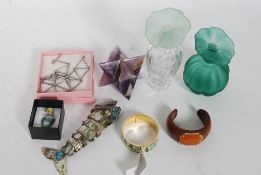 A collection of items to include costume jewellery, amethyst stone carved into a stone,