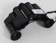 A pair of vintage ' The Folding Minim ' binoculars by Negretti & Zambra of London.