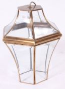 A decorative 20th century brass and glass hanging lamp, with bevelled glass panels.