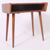A 1970's retro angular Danish side cabinet raised on tapering supports with open shelf to top.