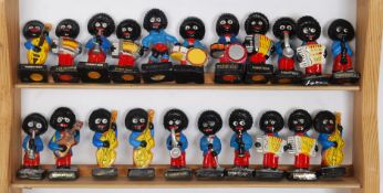 A collection of 21 x vintage Golly Robertsons Jam plaster figures of a band