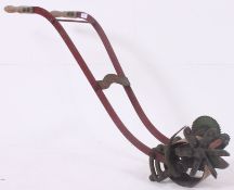 A vintage Ransomes lawn edge trimmer,