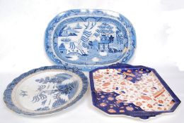 A 19th century Chinese Imari pattern meat platter together with 2 early blue and white willow