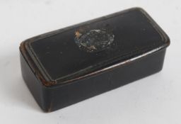 A 19th century papier mache gentlemans snuff box of lozenge shaped with hinged lid