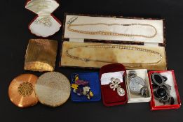 A collection of ladies costume jewellery to include brooches etc along with 3 x compacts,