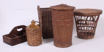 A large collection of vintage wicker containers - laundry basket, double handled basket,