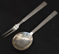 A mid century Georg Jensen Sterling Silver marked serving spoon and fork in the  Bernadotte Pattern.