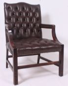 A Gainsborough style mahogany and leather armchair - office desk chair with shaped elbow  supports