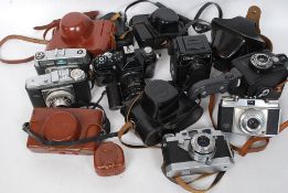 A collection of vintage 35mm cameras and leather casaes to include Lubitel 166B, Gevabox, Dacora,