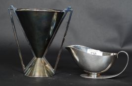 An Art Deco 1938 registered design creamer in silver plate. Bearing Rd 831101 to side.