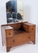 A 1930's oak drop centre dressing table - chest of drawers with large mirror between each pedestal