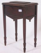 A vintage C1930's work box, raised on square tapered legs with sarcophagus body atop.