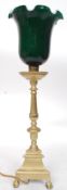 A mid century brass and green glass shade upright bankers lamp.