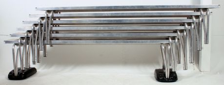 A set of six metamorphic folding stacking school benches complete with castors for easy movement (