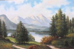 A framed oil on canvas depicting an Austrian  lake and mountain scene signed to lower corner