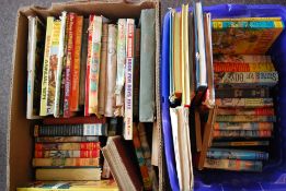 A collection of children's books and annuals dating from the middle of the 20th century to include