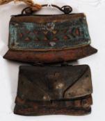 2 Eastern leather and brass mounted steel tinder strikers - pouches. One with contents.