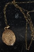 A 9ct gold locket and necklace. The lozenge shaped locket being decorated with celtic knot design.