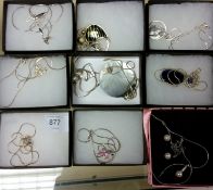 A collection of 10 silver and white metal decorative ladies necklaces in presentation boxes to