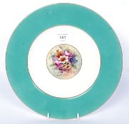 A Royal Worcester cabinet plate with still life hand painted panel by A Barker bearing puce mark to