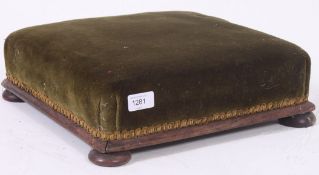 A 19th century large Victorian mahogany and green velour upholstered footstool,